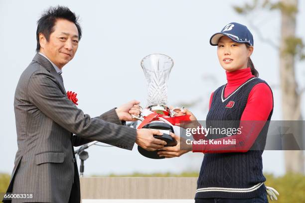 Eri Fukuyama receives a winning trophy from Ningineer Network Co. President Tadashi Murakami after the final round of the Rashink Nijinia/RKB Ladies...