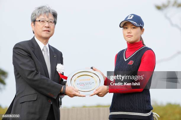 Eri Fukuyama receives a winning plate from RKB President Ryoji Inoue after the final round of the Rashink Nijinia/RKB Ladies at the Queens Hill Golf...