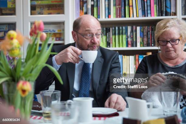 Martin Schulz, chairman of the Social Democratic Party of Germany , speaks to elderly residents during a visit to the multi-generational house...