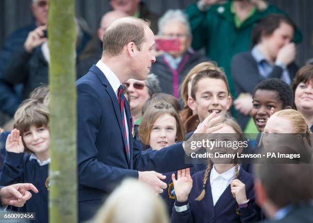 The Duke of Cambridge meeting schoolchildren during a visit to open a new remembrance centre at the National Memorial Arboretum in Alrewas,...