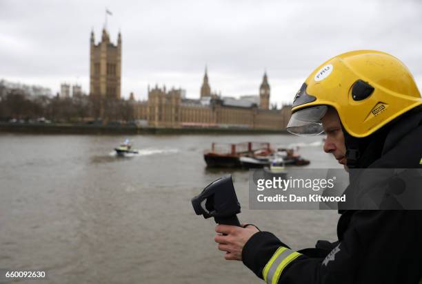 Emergency services look for a person thought to have fallen from Westminster Bridge into the River Thames on March 29, 2017 in London, England.
