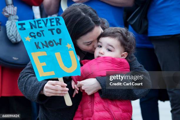 Young child joins protesters from Open Britain as they demonstrate outside the Houses of Parliament on March 29, 2017 in London, England. Today...