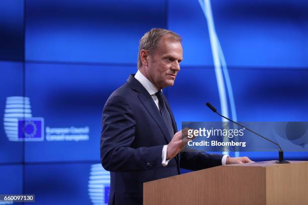Donald Tusk, president of the European Union , holds the letter invoking Article 50 of the Lisbon Treaty from U.K. Prime Minister Theresa May as he...