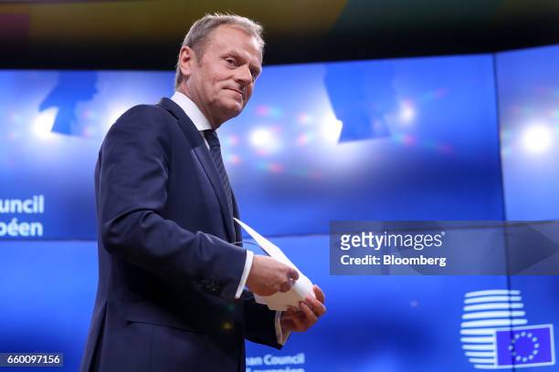 Donald Tusk, president of the European Union , holds the letter invoking Article 50 of the Lisbon Treaty from U.K. Prime Minister Theresa May as he...