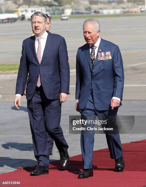 Prince Charles, Prince of Wales arrives at Otopeni International Airport and is escorted by George Ciamba, Secretary of State, Ministry of Foreign...