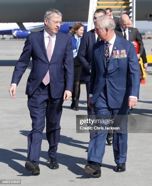 Prince Charles, Prince of Wales arrives at Otopeni International Airport and is escorted by George Ciamba, Secretary of State, Ministry of Foreign...