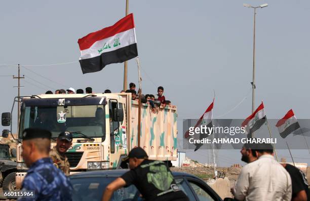Displaced Iraqis, who fled their homes in the old city of western Mosul due to the ongoing fighting between government forces and Islamic State group...