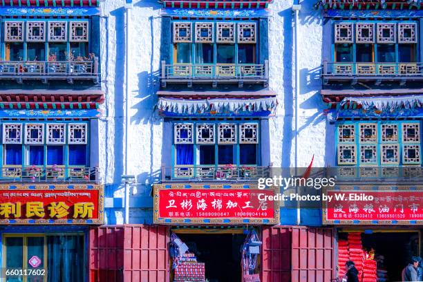 market street of lhasa - 壁 stock pictures, royalty-free photos & images