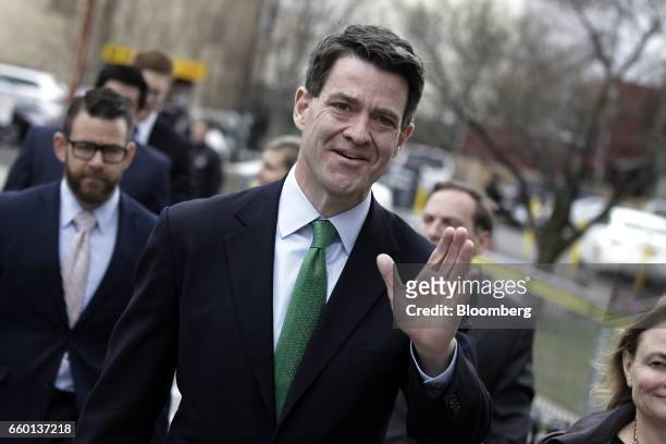 Bill Baroni, former deputy executive director of the Port Authority of New York & New Jersey, waves while arriving at federal court in Newark, New...
