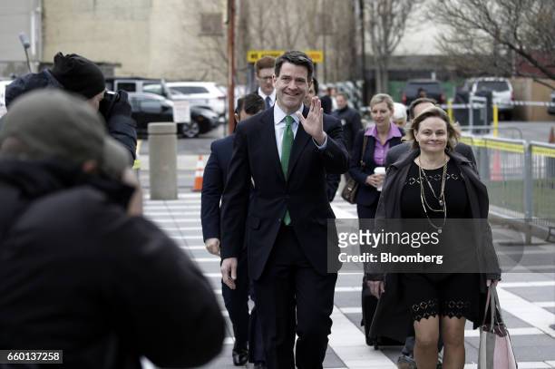Bill Baroni, former deputy executive director of the Port Authority of New York & New Jersey, center, waves while arriving at federal court in...