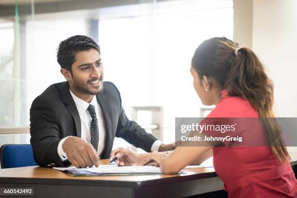 two young sri lankan business colleagues in modern office - sri lanka woman stock pictures, royalty-free photos & images