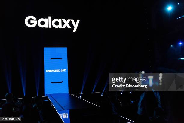 Attendees wait for the start of the Samsung Unpacked product launch event in New York, U.S., on Wednesday, March 29, 2017. Samsung Electronics Co....