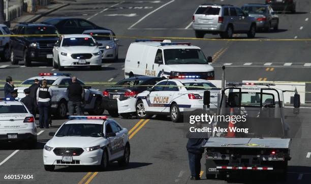 Police investigate at the scene of an incident on March 29, 2017 on Capitol Hill in Washington, DC. U.S. Capitol Police fired shots at a female...
