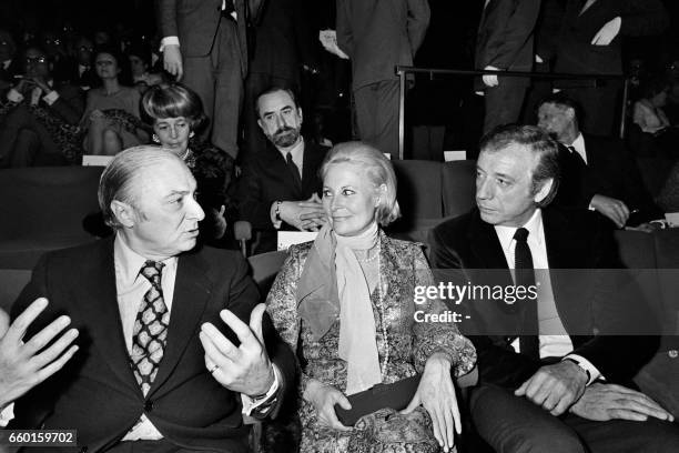 Fom left, French director Gérard Oury, his wife French actress Michele Morgan and French actor Yves Montand attend the premiere of the film "Les...