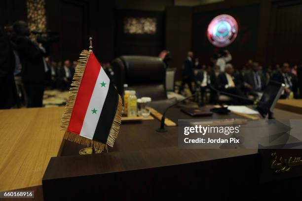 Syria's gevernment flag is seen in front of its empty chair during the Arab League summit in the Jordanian Dead Sea resort of Sweymah, Jordan, March...