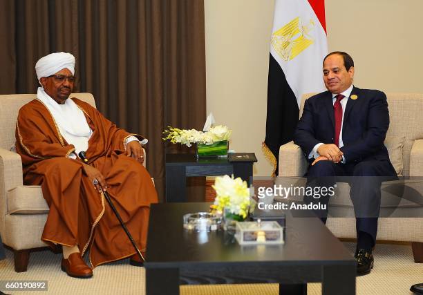 Sudanese President Omar al-Bashir meets Egyptian President Abdel Fattah el-Sisi as part of the 28th Arab League Summit in Amman, Jordan on March 29,...