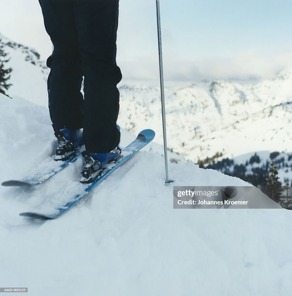 Skier Standing on the Edge