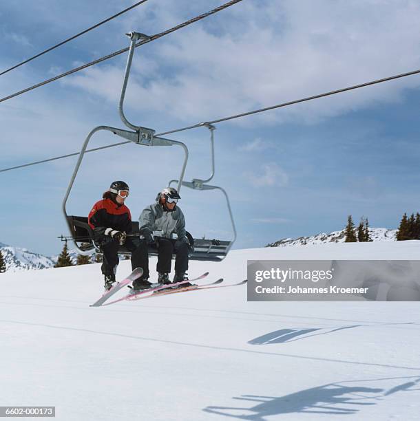 skiers on ski lift - ski lift stock pictures, royalty-free photos & images