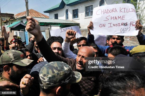 Engineer Rashid , an independent member of the Jammu and Kashmir state assembly and leader of Awami Ittihad Party , shouts slogans as policemen...