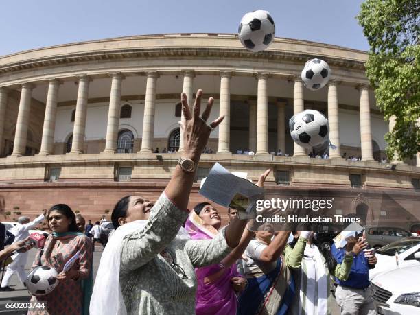 Members of Parliament playing football after Lok Sabha Speaker Sumitra Mahajan presented footballs to Members of Parliament as part of the Mass...