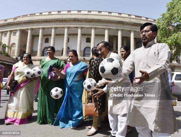 Members of Parliament playing football after Lok Sabha Speaker Sumitra Mahajan presented footballs to Members of Parliament as part of the Mass...