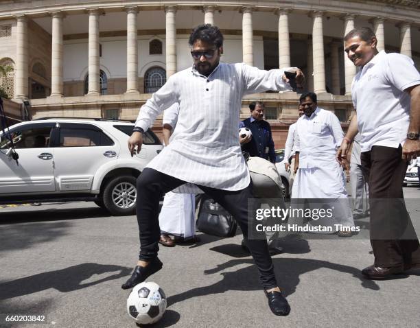 Union Minister of State of Heavy Industries and Public Enterprises Babul Supriyo and Praful Patel, Member of Parliament, playing football after Lok...