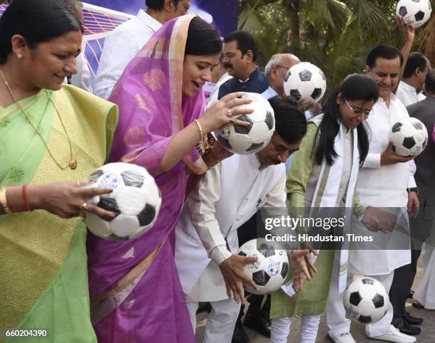 Members of Parliament play football during the 'Mission XI Million: Taking Football Across India' organized by Ministry of Youth Affairs and Sports...