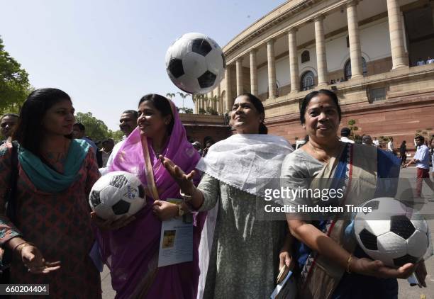 Members of Parliament play football during the 'Mission XI Million: Taking Football Across India' organized by Ministry of Youth Affairs and Sports...