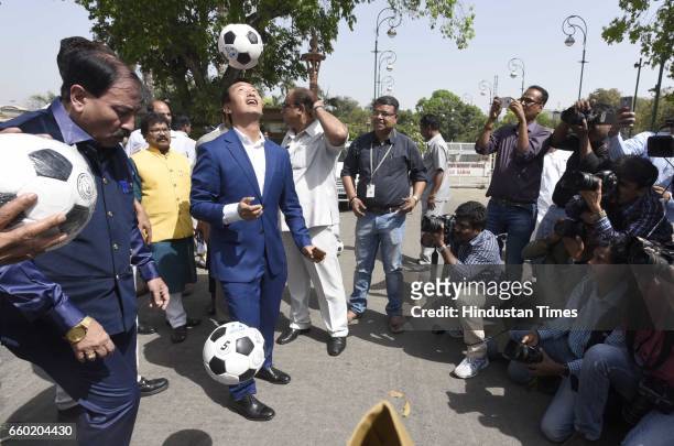 International footballer and Member of Parliament from Howrah Prasun Banerjee and Indian footballer Baichung Bhutia play football during the 'Mission...