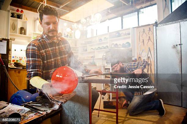 glass blowers in studio - glass blowing stock pictures, royalty-free photos & images