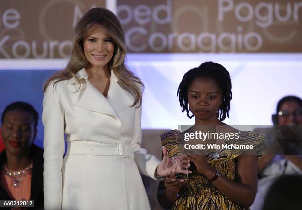 First lady Melania Trump presents the 2017 Secretary of State's International Women of Courage Award to Rebecca Kabugho of the Democratic Republic of...