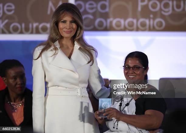 First lady Melania Trump presents the 2017 Secretary of State's International Women of Courage Award to Sandya Eknelgoda of Sri Lanka March 29, 2017...