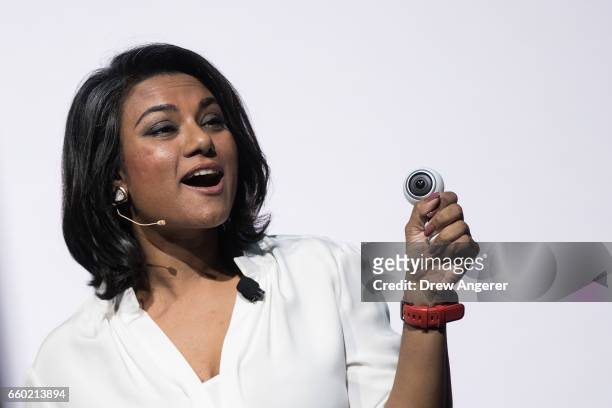 Suzanna De Silva, director of product strategy at Samsung, holds up a new version of the Samsung Gear 360 camera during a launch event for the...