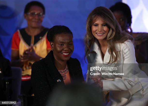 First lady Melania Trump presents the 2017 Secretary of State's International Women of Courage Award to Malebogo Molefhe of Botswana March 29, 2017...