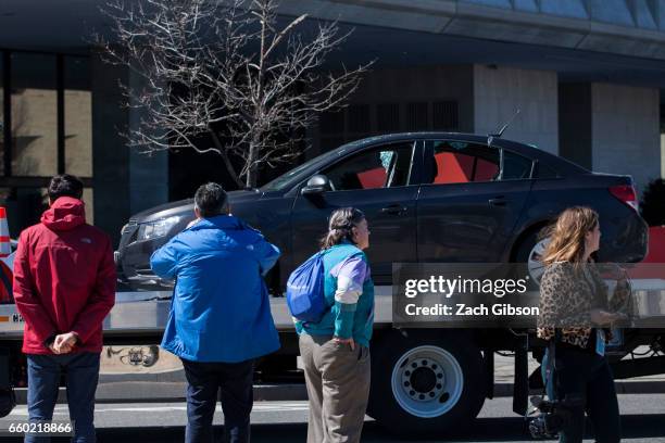 Police tow a car away from the scene of an incident on March 29, 2017 on Capitol Hill in Washington, DC. U.S. Capitol Police fired shots at a female...