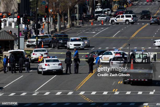 Police investigate at the scene of an incident on March 29, 2017 on Capitol Hill in Washington, DC. U.S. Capitol Police fired shots at a female...