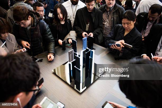 Attendees view Samsung Electronics Co. Galaxy S8+ smartphones displayed during the Samsung Unpacked product launch event in New York, U.S., on...