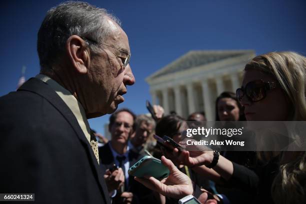 Senate Judiciary Committee Chairman Sen. Chuck Grassley answers questions from members of the media after a news conference in front of the Supreme...