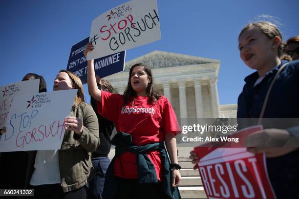 Activists counter protest during a news conference in front of the Supreme Court March 29, 2017 in Washington, DC. Senator Chuck Grassley held a news...