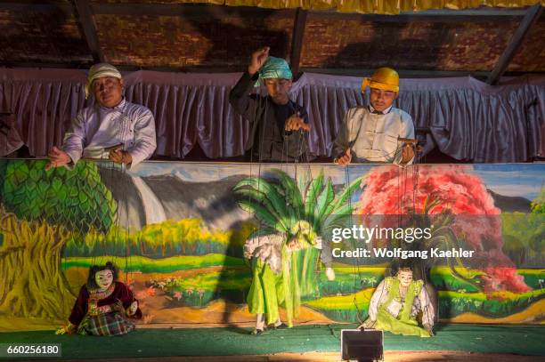 Puppeteers are performing a traditional puppet show in Bagan, Myanmar.