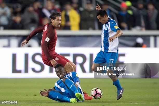 United States defender Omar Gonzalez battles with Honduras midfielder Romell Quioto and Honduras midfielder Andy Najar for a loose ball during their...