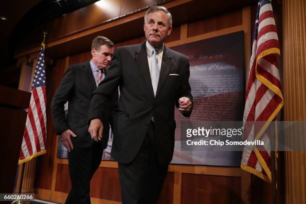 Senate Intelligence Committee ranking member Sen. Mark Warner and Chairman Richard Burr leave a news conference about the committee's investigation...