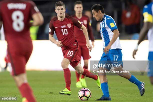 United States midfielder Christian Pulisic battles with Honduras midfielder Andy Najar during their FIFA 2018 World Cup Qualifier between USA and...