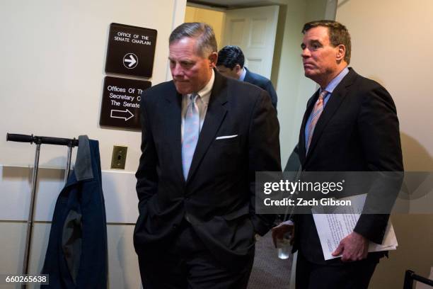 Sens. Richard Burr and Mark Warner head to a news conference to provide an update on the committee's investigation of Russian interference in the...