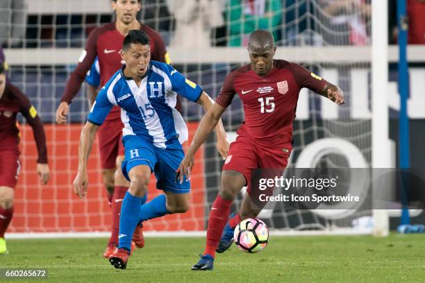 Honduras midfielder Roger Espinoza battles with United States midfielder Darlington Nagbe during their FIFA 2018 World Cup Qualifier between USA and...