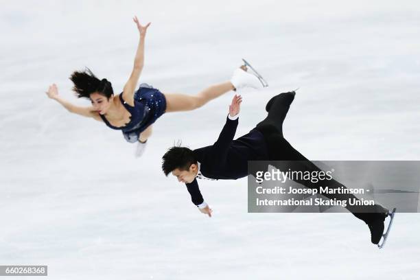 Wenjing Sui and Cong Han of China compete in the Pairs Short Program during day one of the World Figure Skating Championships at Hartwall Arena on...
