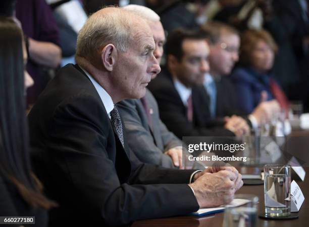 John Kelly, secretary of U.S. Homeland Security, listens while U.S. President Donald Trump, not pictured, speaks during an opioid and drug abuse...