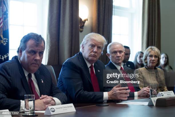 New Jersey Governor Chris Christie, from left, U.S. President Donald Trump, Jeff Sessions, U.S. Attorney general, and Betsy DeVos, U.S. Secretary of...