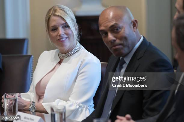 Pam Bondi, Florida attorney general, left, and Mariano Rivera, former professional baseball player with the New York Yankees, listen while U.S....