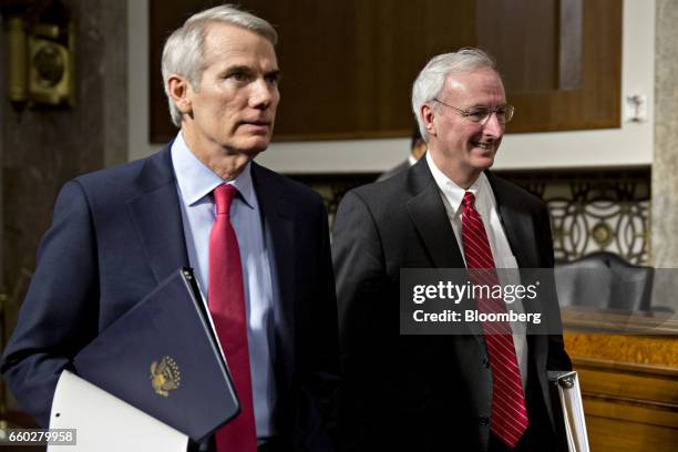 Jeffrey Rosen, deputy transportation secretary nominee for U.S. President Donald Trump, right, and Senator Rob Portman, a Republican from Ohio,...